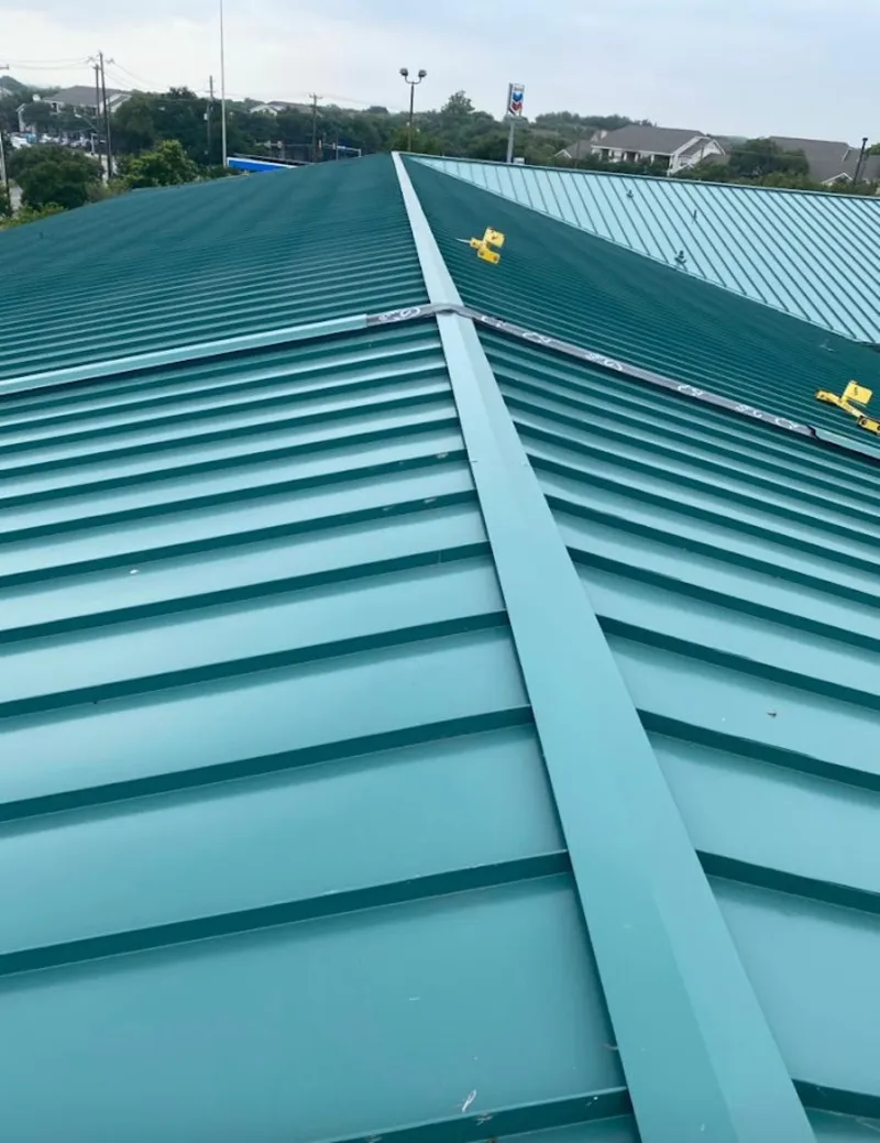 Green commercial metal roof ridge and valley for Metal Roof Repair in Littleton